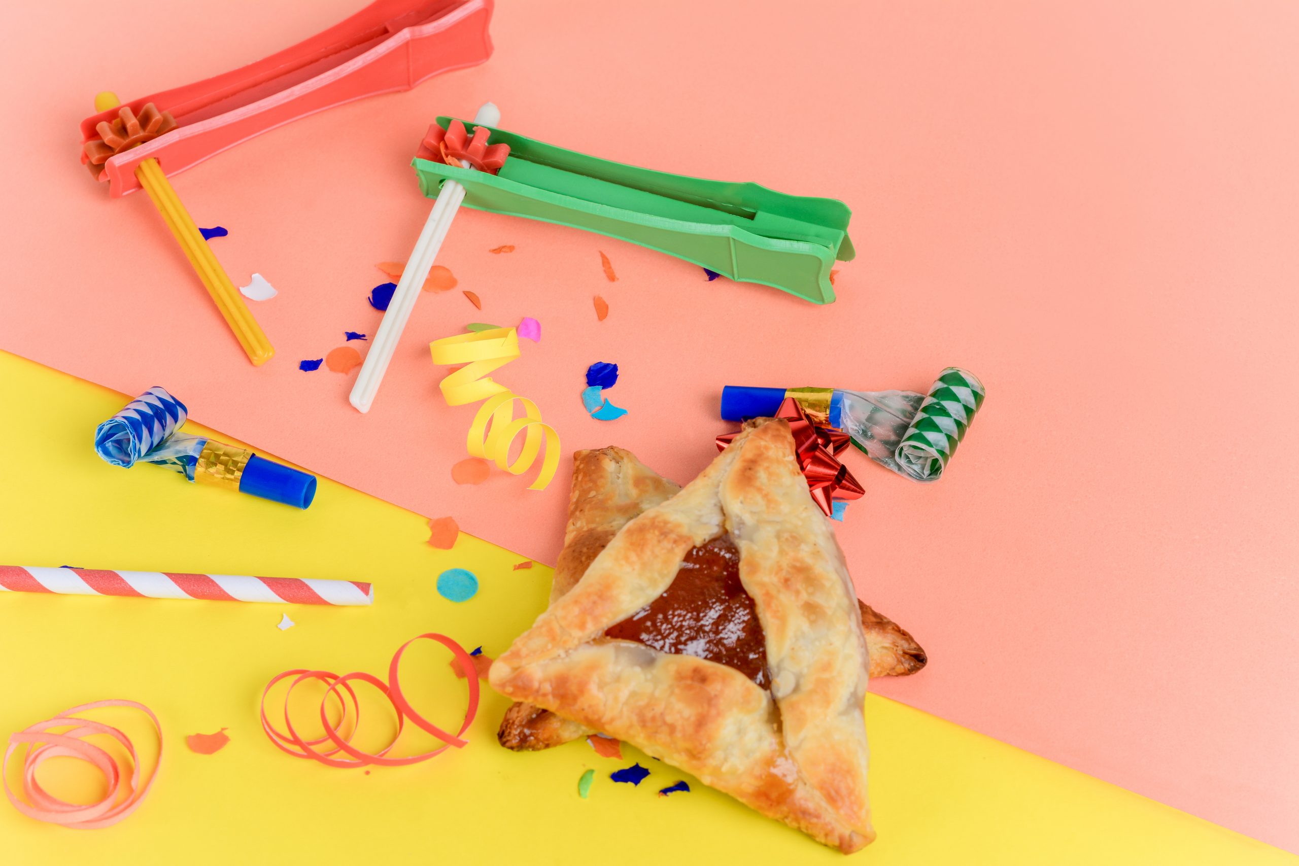 Purim Background with party costume and hamantasch